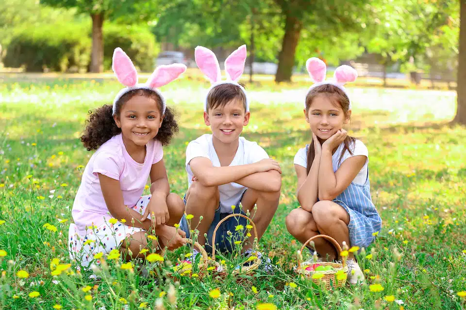 Three kids with healthy Easter baskets