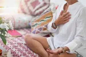 Woman meditating thanks to meditation membership
