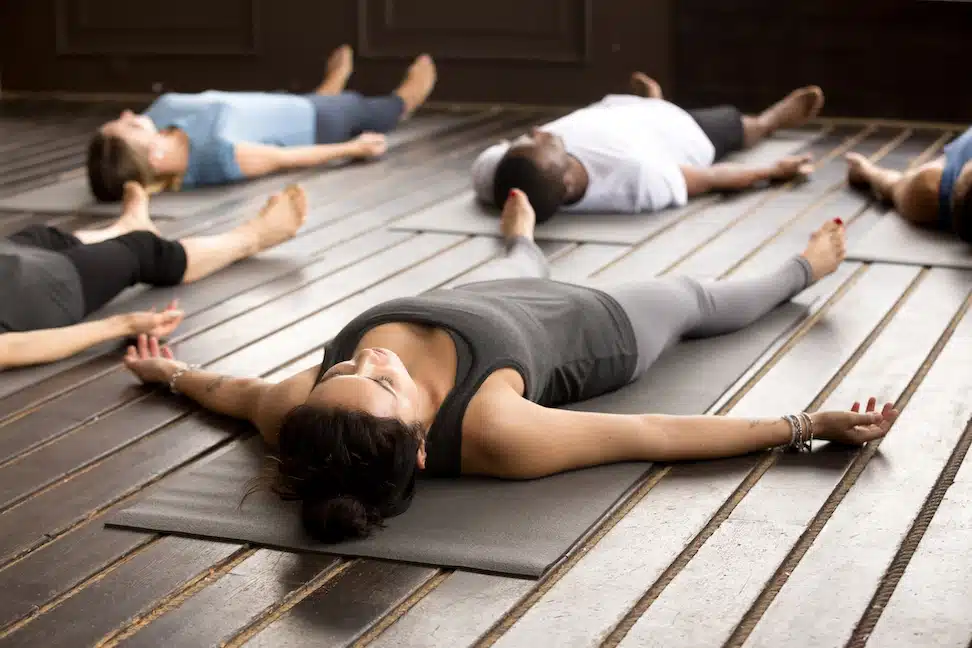 Diverse group of individuals practicing yoga nidra