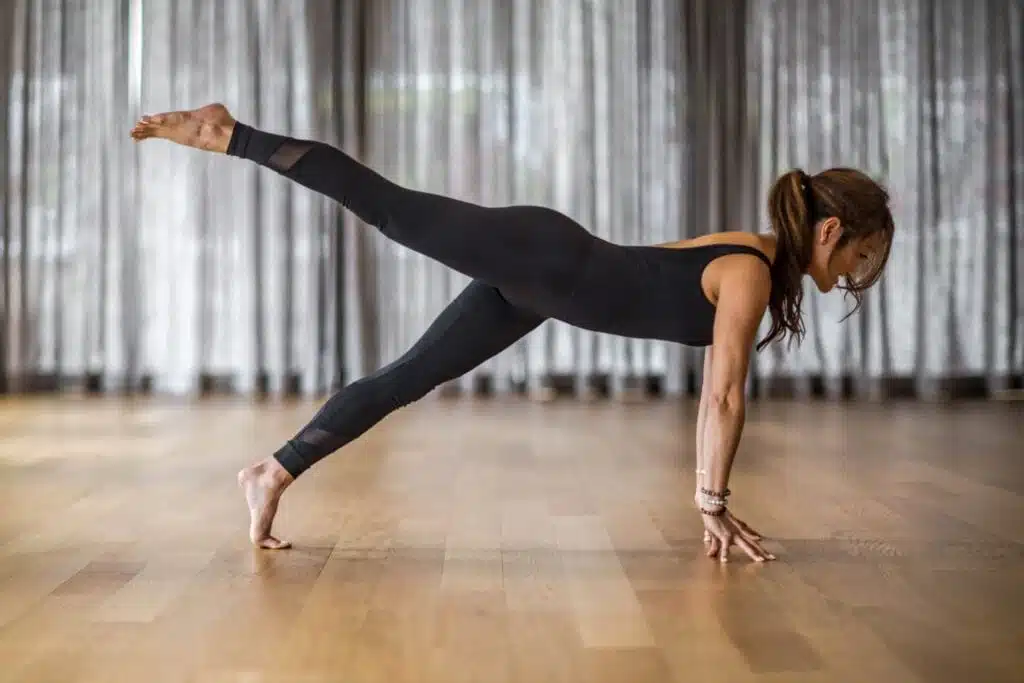 Anna Haddad in a plank-like yoga post