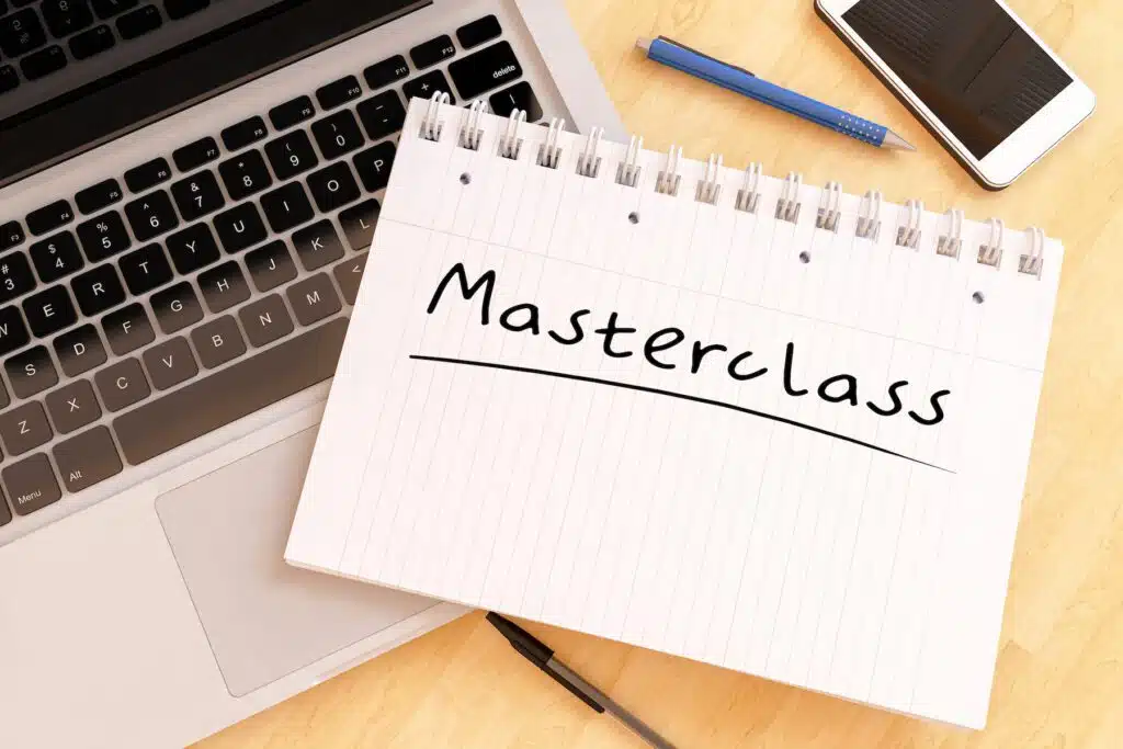 Computer with a notebook with the word Masterclass written on it