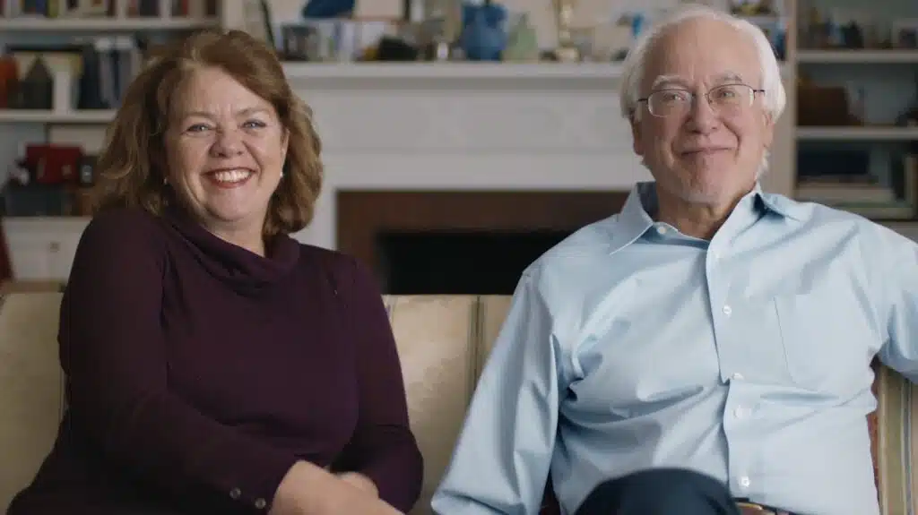 Martin Blaser, M.D. and Gloria Dominguez-Bello, Ph.D. laughing on a couch
