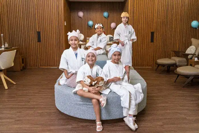 A bunch of kids in bathrobes at Jungle Kids Spa