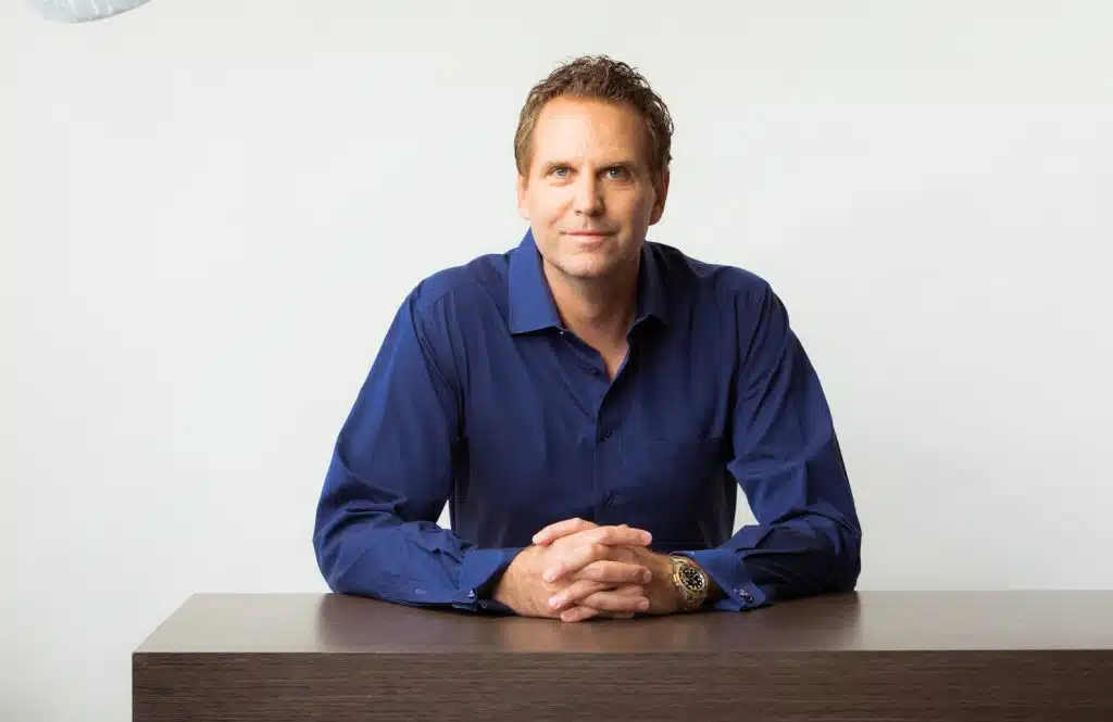 Marc Ronert, M.D.. sitting at a table