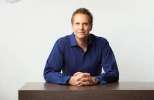 Marc Ronert, M.D.. sitting at a table