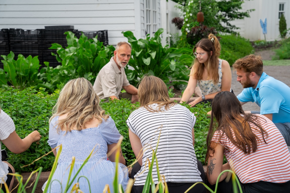 Director of Horticulture at The Lakehouse on Canandaigua shows guests the garden.